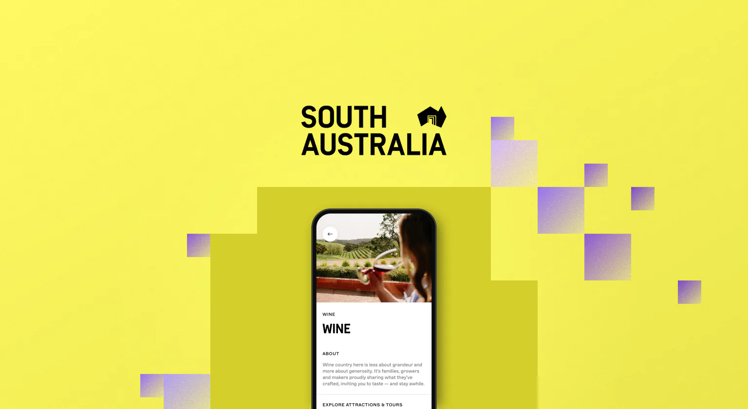 The South Australia wordmark in black on yellow, beside a phone showing the Wine guide in the Explore South Australia app, a photo of a woman tasting red wine above its About text, edged with purple pixel cubes